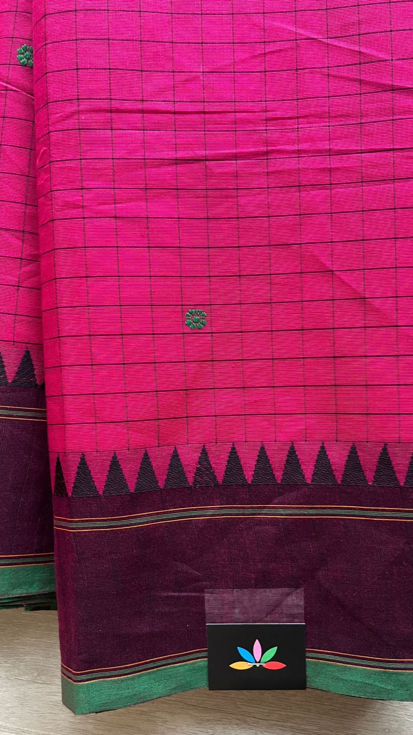 Pink and green saree with a visible brand logo on a neutral background