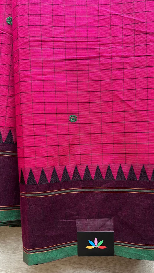 Pink and green saree with a visible brand logo on a neutral background